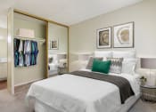 Thumbnail 6 of 22 - Bedroom with a mirrored closet doors, carpeted floors