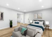 Thumbnail 12 of 49 - a living room with a couch and a bed