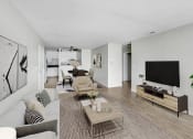 Thumbnail 3 of 15 - a living room with a couch and a television