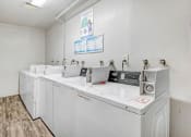 Thumbnail 15 of 15 - the laundry room is equipped with washes and dryers and has a counter top