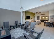 Thumbnail 4 of 26 - a dining area with a table and chairs and a living room