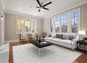 Thumbnail 1 of 7 - a living room with a couch and a coffee table