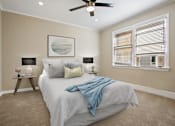 Thumbnail 5 of 7 - a bedroom with a bed and a ceiling fan