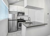Thumbnail 13 of 62 - a kitchen with stainless steel appliances and a counter top