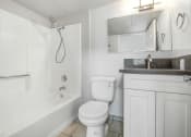Thumbnail 18 of 62 - a bathroom with a toilet and a tub and a sink
