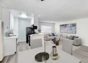 Thumbnail 7 of 95 - an open living room and kitchen with a white table