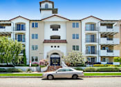Thumbnail 84 of 88 - a car parked in front of an apartment building