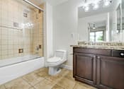 Thumbnail 45 of 88 - a bathroom with a toilet and a tub and a sink