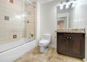 Thumbnail 46 of 88 - a bathroom with a toilet and a tub and a sink