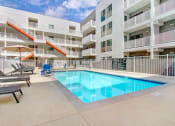 Thumbnail 82 of 83 - a swimming pool in the middle of an apartment building