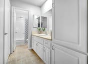Thumbnail 10 of 14 - a white bathroom with a sink and a shower