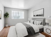 Thumbnail 4 of 14 - a bedroom with a large bed and a window