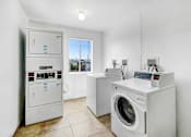Thumbnail 9 of 11 - laundry room with washer and dryer and a window