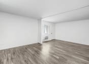 Thumbnail 63 of 66 - an empty living room with white walls and wood floors