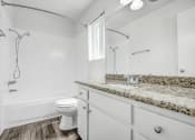 Thumbnail 52 of 66 - a white bathroom with a sink and a toilet
