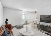 Thumbnail 3 of 66 - a living room with a couch and a tv