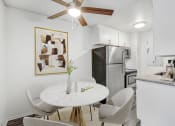 Thumbnail 2 of 66 - a kitchen and dining room with a white table and chairs