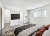 Thumbnail 5 of 66 - the master bedroom has a large bed and a tv on the wall