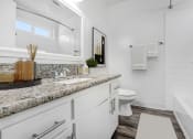 Thumbnail 8 of 66 - a white bathroom with a sink and a toilet