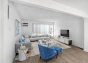 Thumbnail 3 of 91 - a living room with a couch and a tv