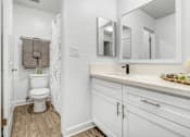 Thumbnail 9 of 91 - a bathroom with a sink and a toilet