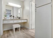 Thumbnail 5 of 61 - a bathroom with a vanity and a mirror