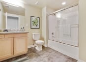 Thumbnail 8 of 20 - a bathroom with a shower toilet and sink