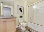 Thumbnail 10 of 20 - a bathroom with a toilet and a shower