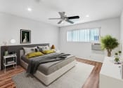 Thumbnail 9 of 57 - a bedroom with a bed and a ceiling fan