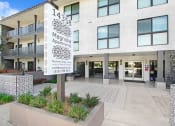 Thumbnail 63 of 64 - the front of a building with a sign in front of it