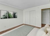 Thumbnail 7 of 64 - a bedroom with a bed and a door to a closet
