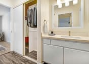 Thumbnail 43 of 61 - a bathroom with a sink and a mirror and a shower