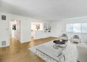 Thumbnail 4 of 52 - a living room with white furniture and a white rug