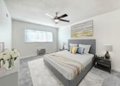 Thumbnail 7 of 52 - a bedroom with a large bed and a ceiling fan