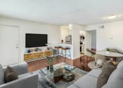 Thumbnail 4 of 102 - a living room with a couch and a coffee table