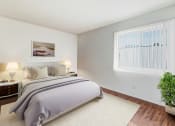 Thumbnail 5 of 102 - a bedroom with a bed and a window