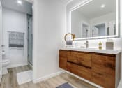 Thumbnail 21 of 29 - Single vanity area with LED mirrored lights, bathroom on the left