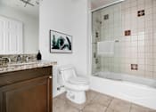 Thumbnail 22 of 88 - a bathroom with a tub and a toilet and a sink