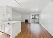 Thumbnail 26 of 60 - A kitchen with white cabinets and a white sink.