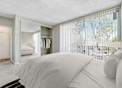 Thumbnail 11 of 18 - A bedroom with a large bed and a wardrobe.