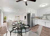 Thumbnail 3 of 67 - A modern kitchen with a glass dining table set for four.