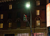 Thumbnail 65 of 72 - a traffic light on a pole in front of a building