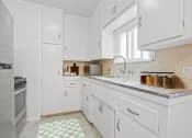 Thumbnail 1 of 35 - a white kitchen with a sink and a window