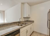 Thumbnail 67 of 102 - Kitchen With Granite Countertops