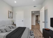 Thumbnail 5 of 12 - a bedroom with a large bed and a tv