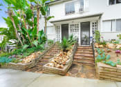 Thumbnail 14 of 17 - a house with a rock garden in front of it