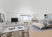 Thumbnail 6 of 45 - a white bedroom with a bed and a white table