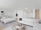 Thumbnail 7 of 45 - a living room with a white couch and a bed
