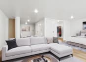 Thumbnail 9 of 45 - a living room with a couch and a table