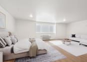 Thumbnail 14 of 45 - a living room with a couch and a bed